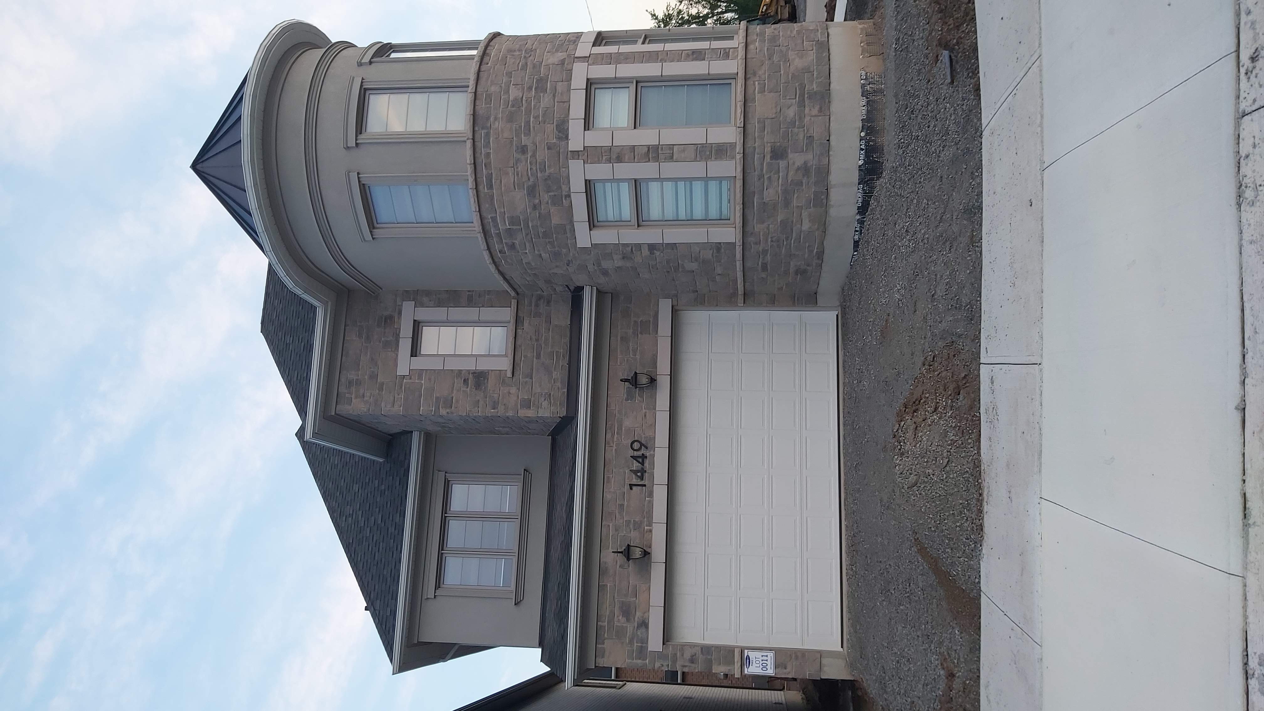 Stone facade with turret on a custom home in Etobicoke, GTA