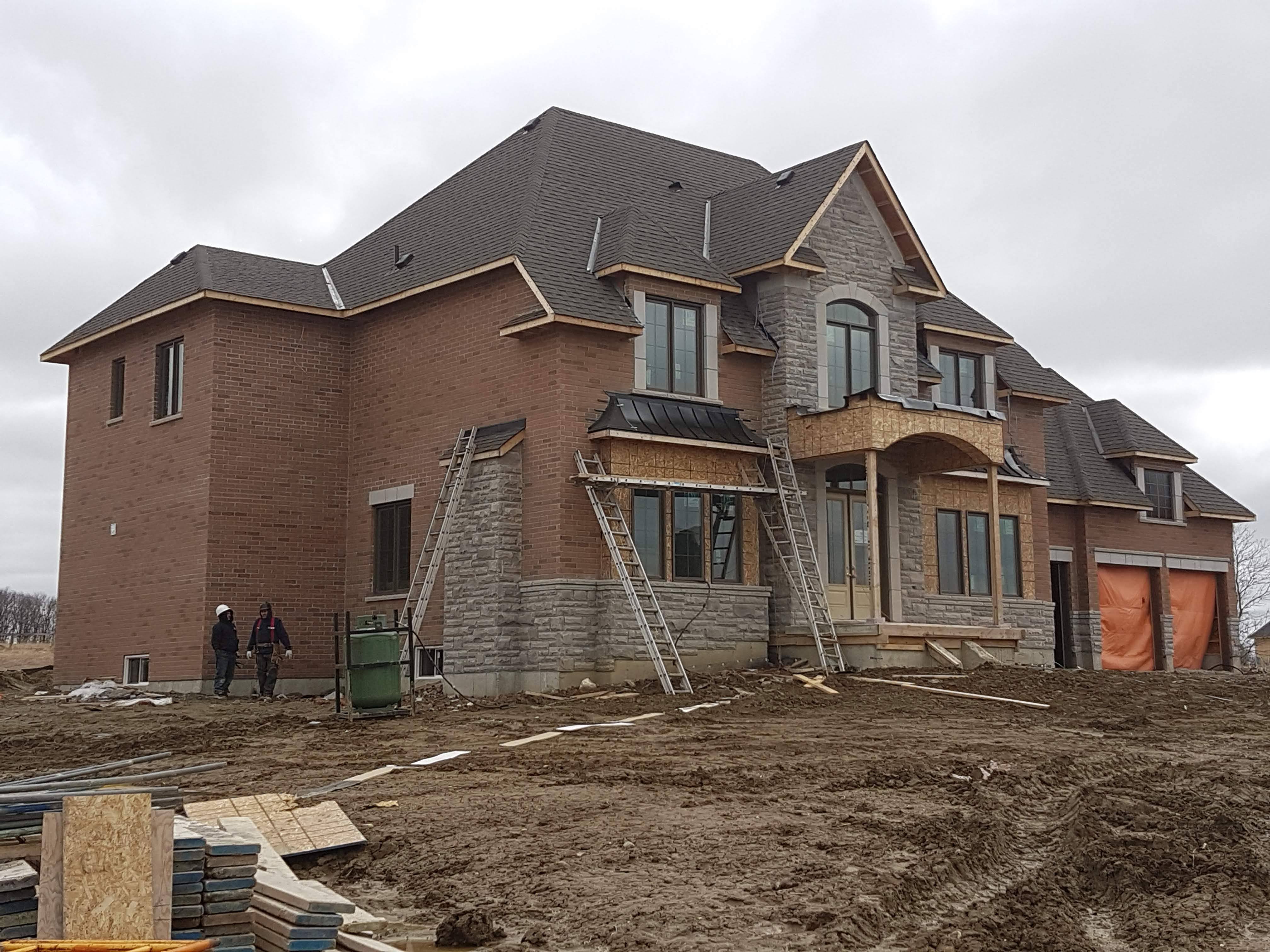 Brick and stone facade work on a custom home in Etobicoke, GTA